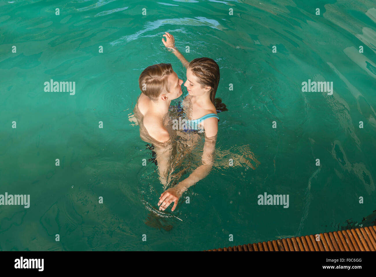 High angle view of passionate couple in swimming pool Stock Photo