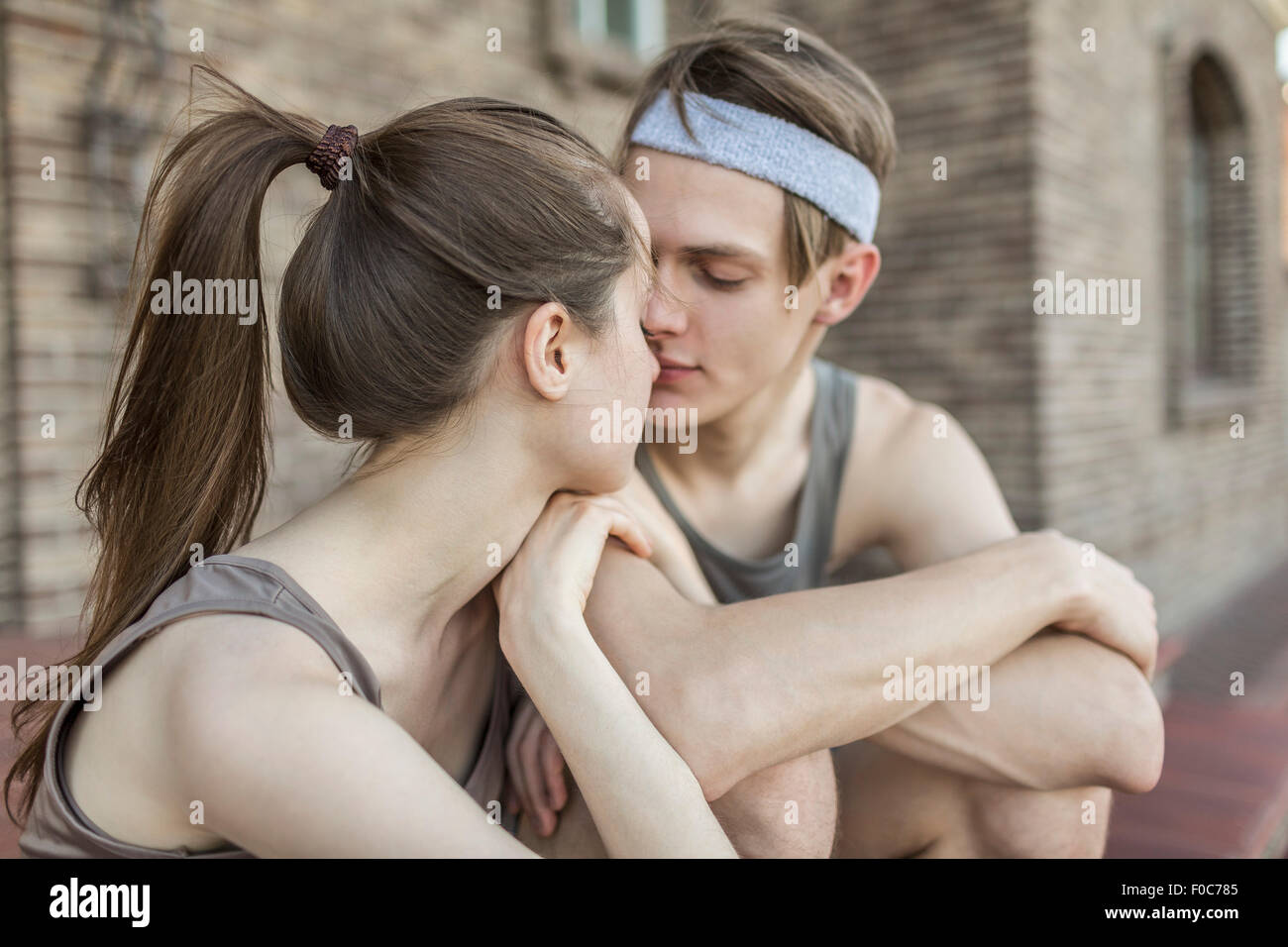 Loving young couple kissing outdoors Stock Photo