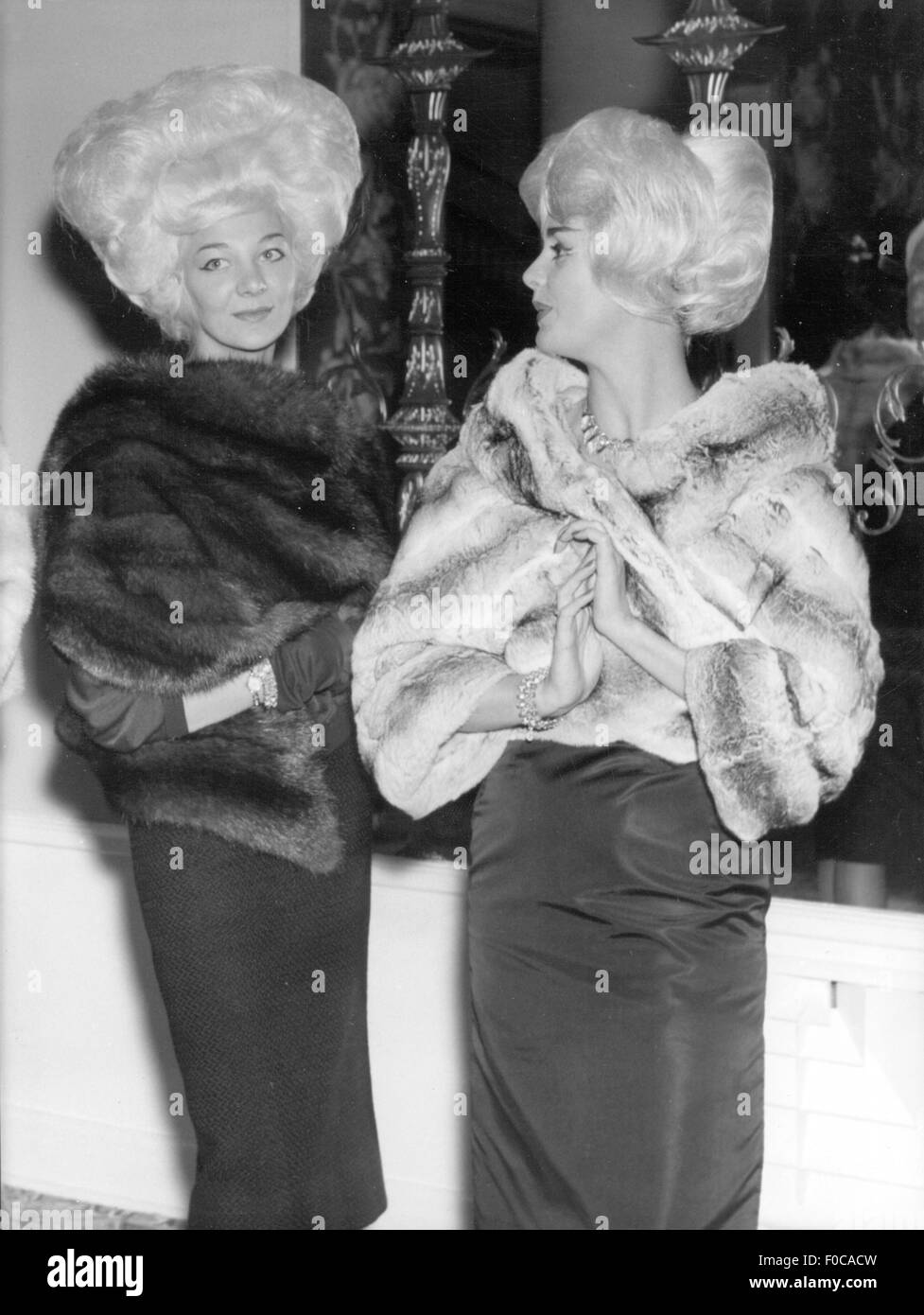 fashion, 1950s, fur, fashion models Jeanette MacConwell and Ann Gyrsting presenting line of fur stoles for young women, London, 7.10.1958, Additional-Rights-Clearences-Not Available Stock Photo