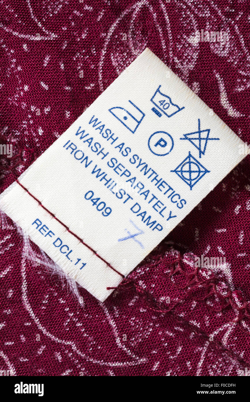 Care instructions label in red patterned dress care washing symbols