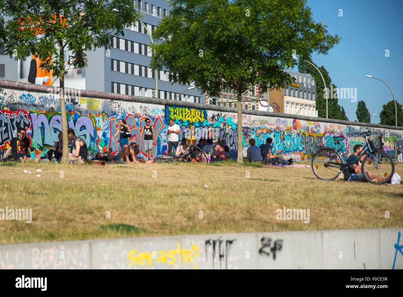 East side gallery street art on Berlin wall by River Spree & Muhlenstrasse Stock Photo