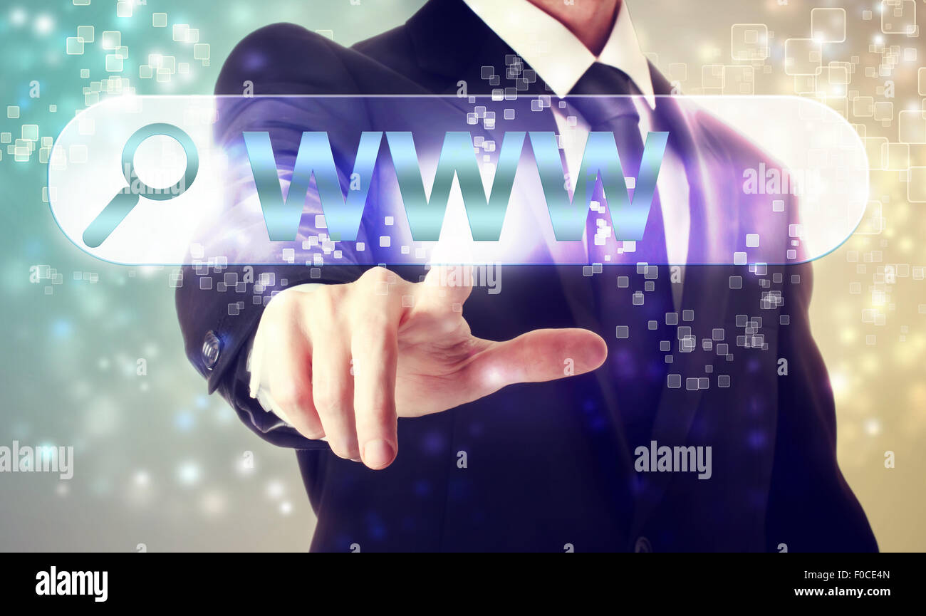 Businessman pressing WWW search button on shiny background Stock Photo