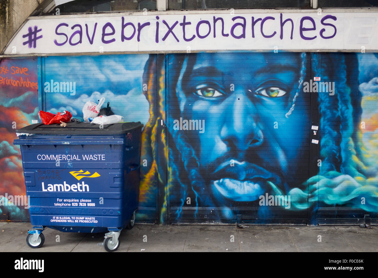 Save Brixton Arches campaign wall painting and graffiti on shop front Brixton London England UK Stock Photo