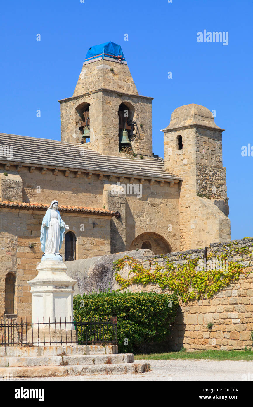 Church of Saint Sauveur and statue of the Virgin Mary at Fos-sur-Mer in France Stock Photo