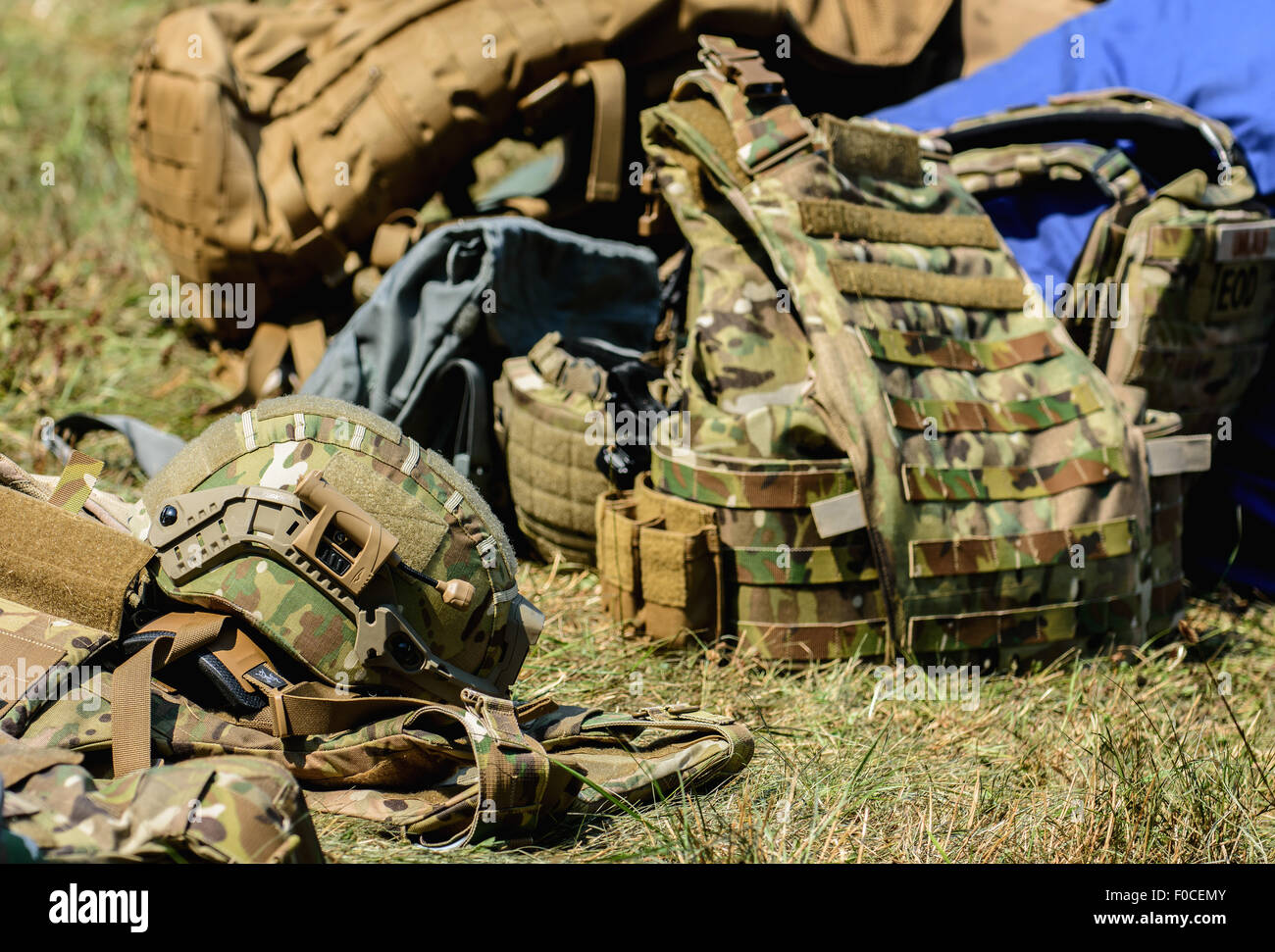 Engelmannsreuth, Germany. 12th Aug, 2015. Vests and helmets providing ballistic protection of the US armed forces lie on a field in the aftermath of a crashed plane near Engelmannsreuth, Germany, 12 August 2015. A US Air Force F-16 crashed near Engelmannsreuth, Germany, on 11 August 2015. Rescue operations are still taking place. Photo: NICOLAS ARMER/dpa/Alamy Live News Stock Photo
