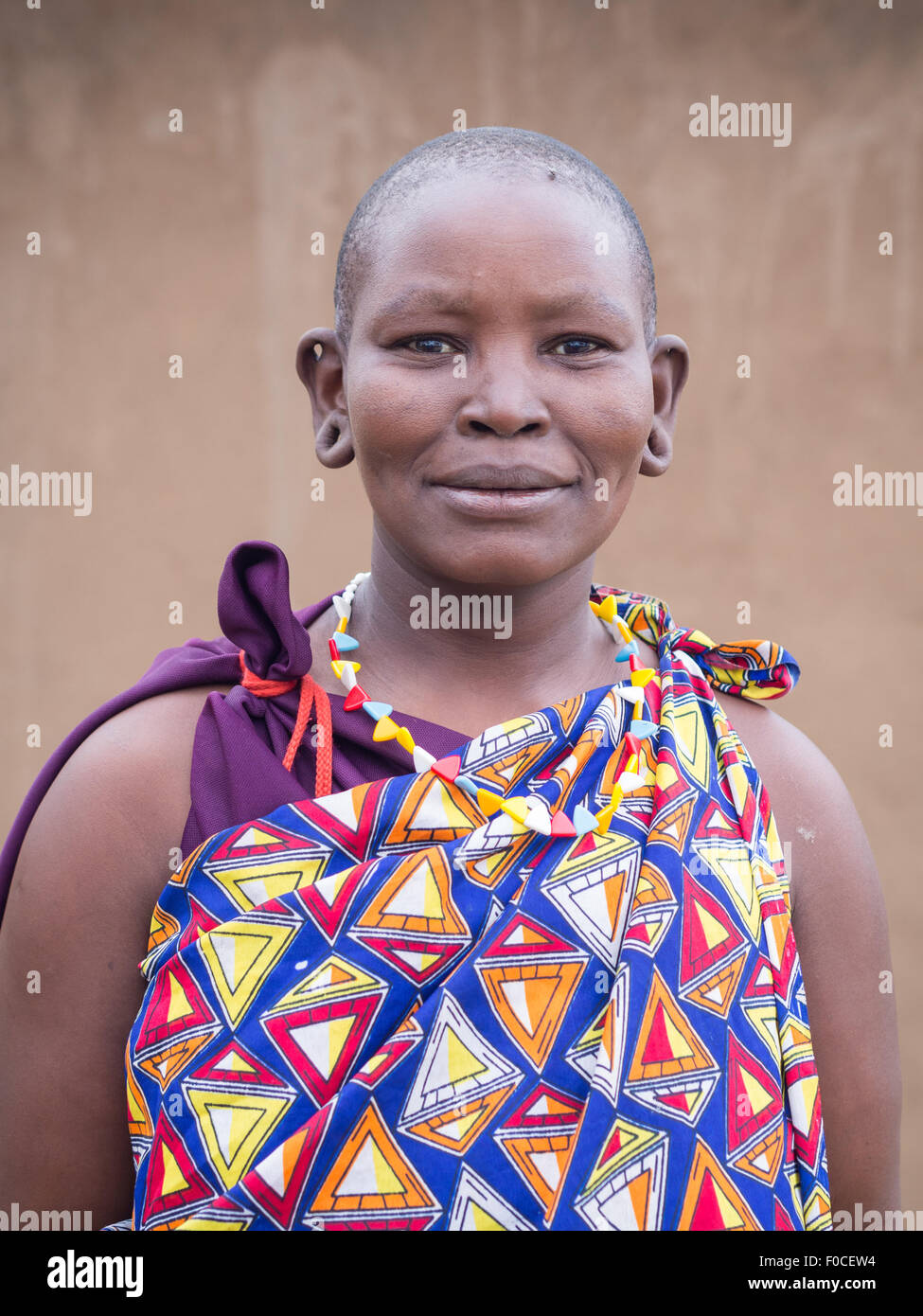 Maasai woman in traditional everyday clothes in her boma (village) in Tanzania, Africa. Stock Photo