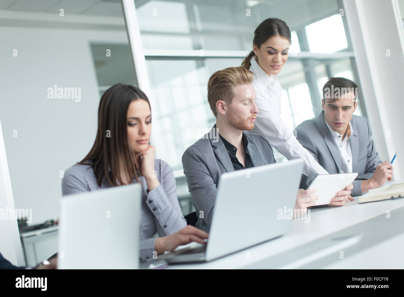 Young people in the office Stock Photo - Alamy