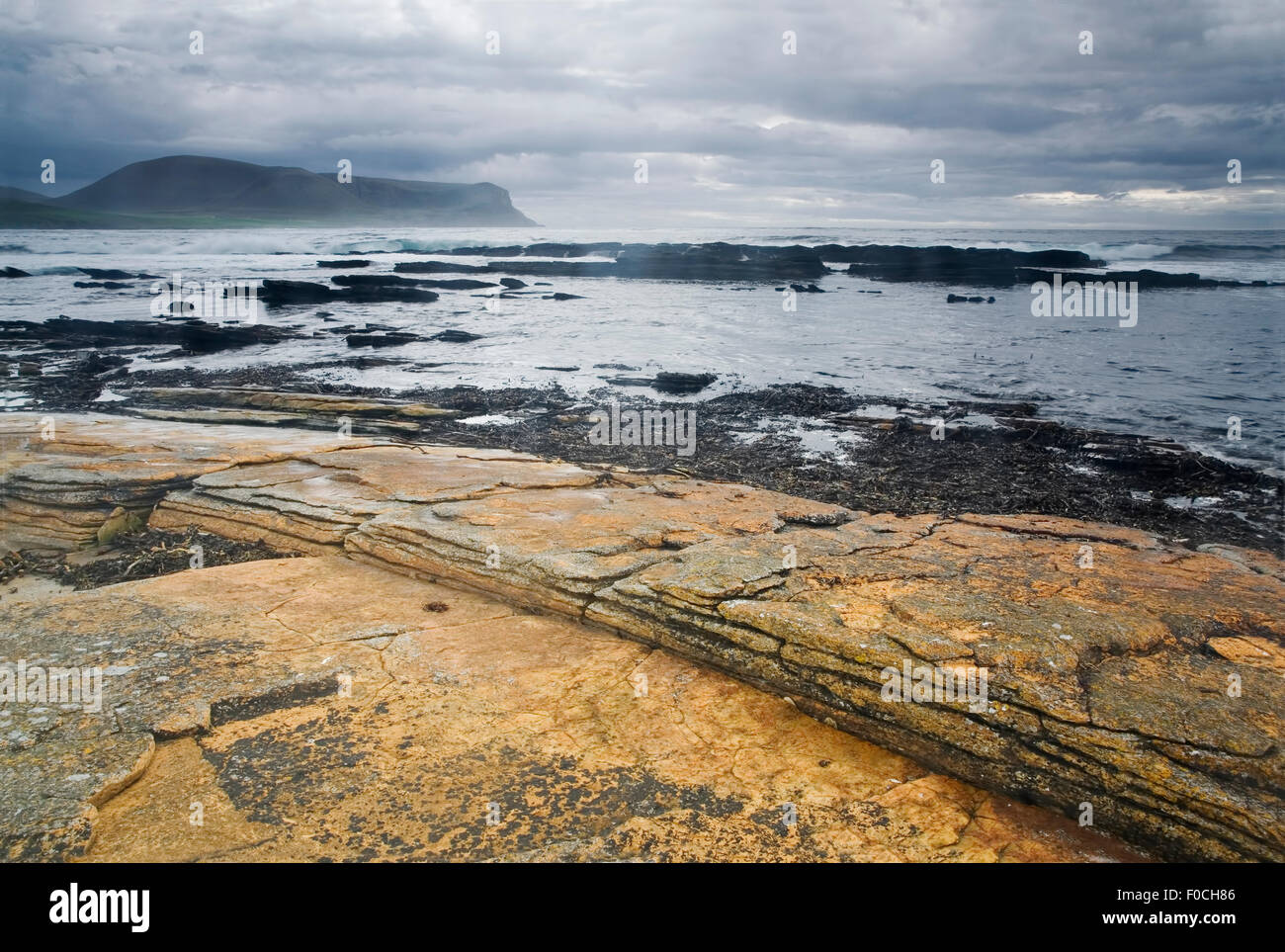 Colorful Warbeth Bay, Orkney with a storm coming Stock Photo
