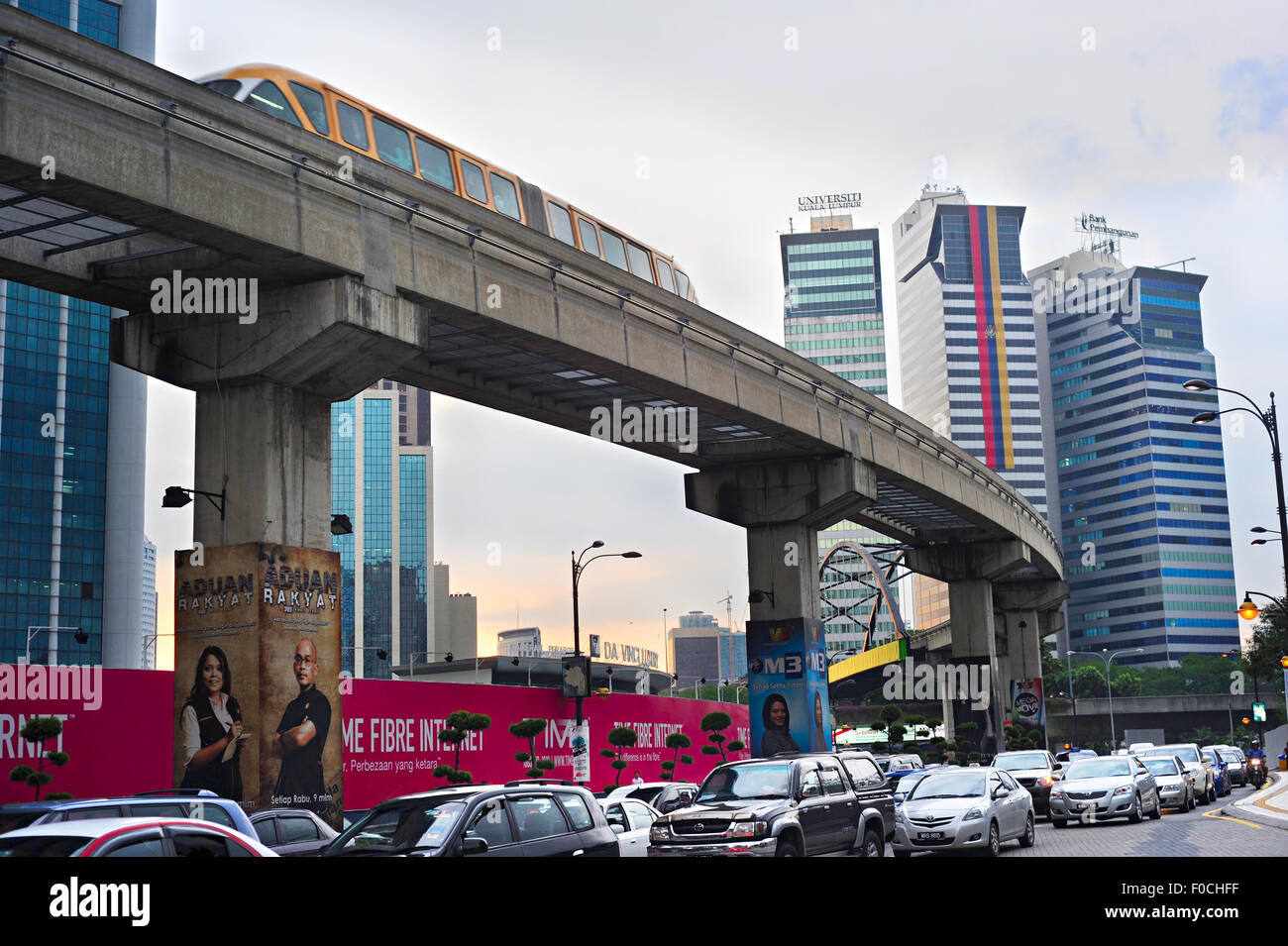 Traffic jam during rush hour and monorail train on elevated rail
