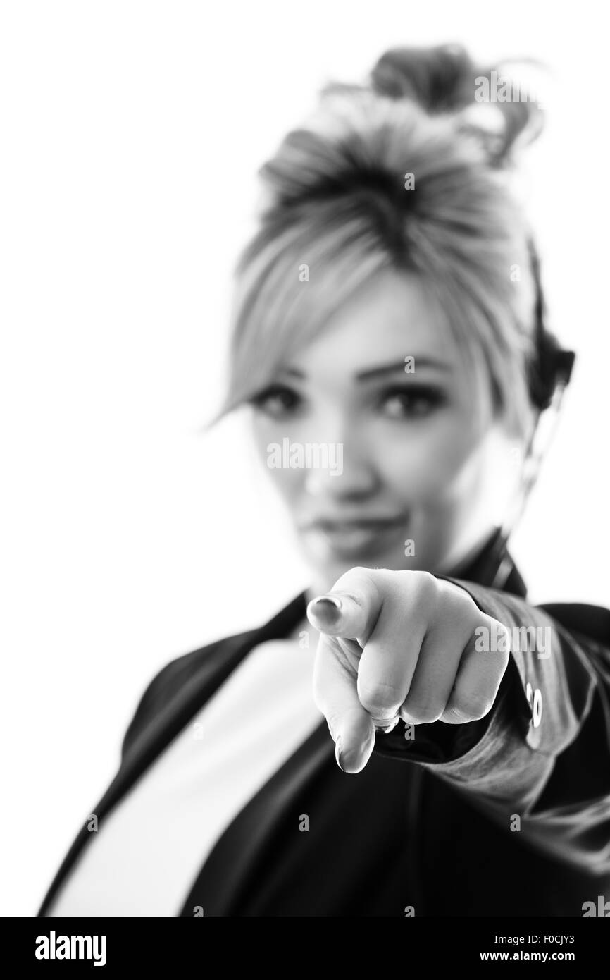 business woman wearing a headset pointing her finger at you Stock Photo