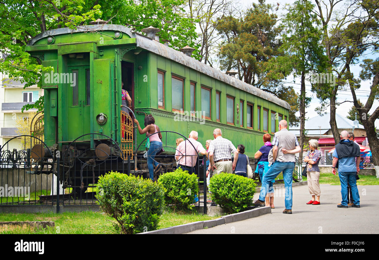 Tourist visit the railroad car of Stalin in front of the Museum of Stalin. Stock Photo