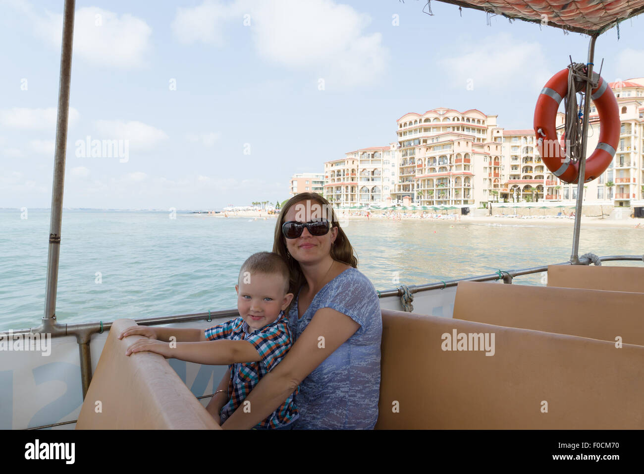 mother with the little son travel by a ship by sea Stock Photo