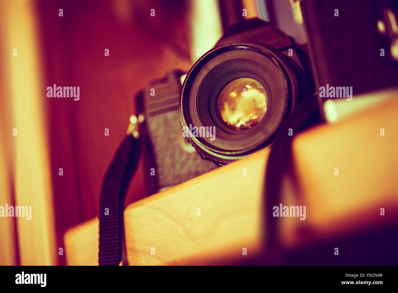 Vintage Film Camera on a Bookshelf. Aged Camera Closeup. Photography