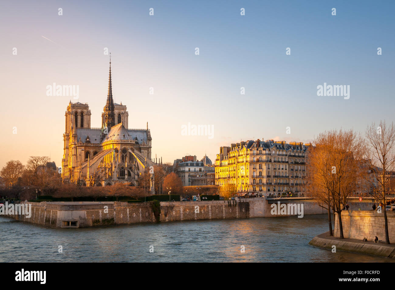Notre Dame cathedral is historic church on the river bank of Seine in Paris France. Stock Photo