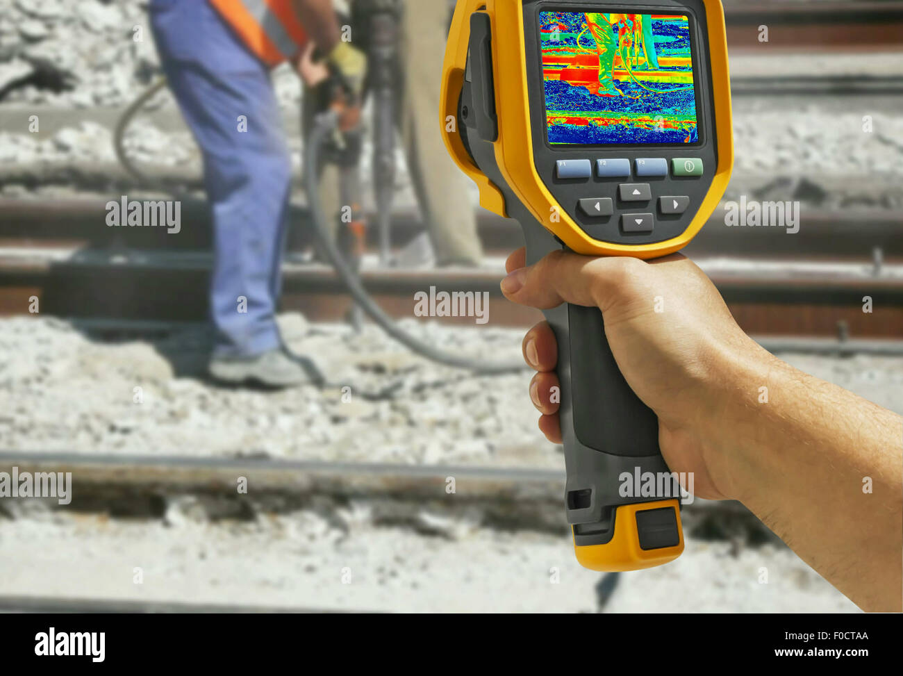 Recording with Infrared camera Two Workers with pneumatic hammer breaking Concrete at construction site Stock Photo