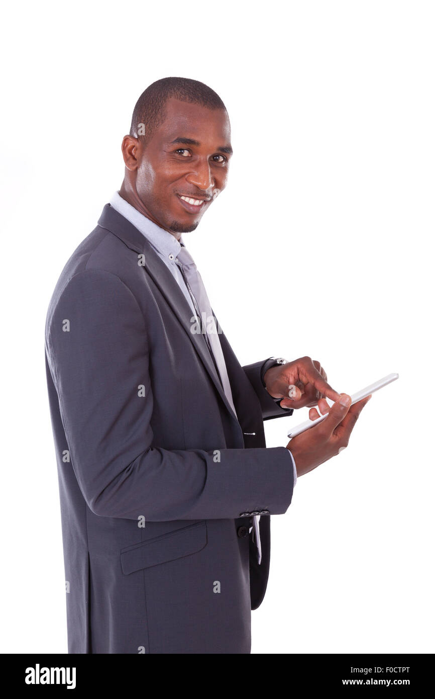 African american business man using a tactile tablet over white ...