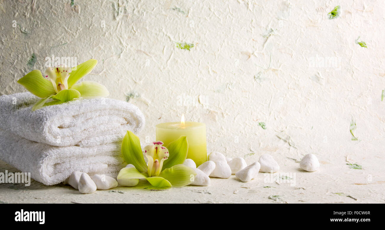 Towel,pebble stones and orchid flower Stock Photo