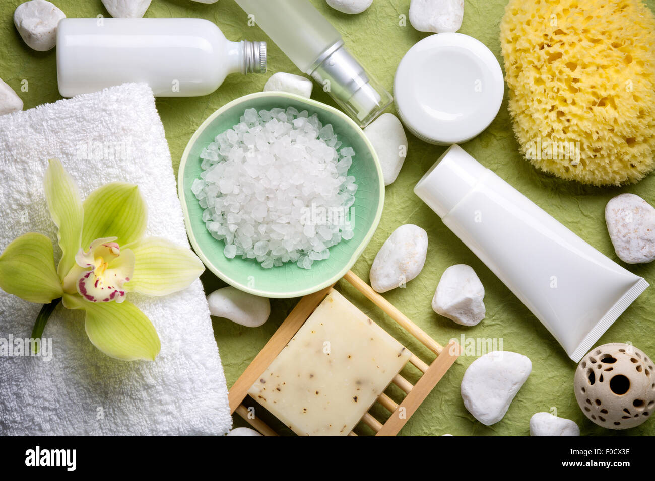 Spa salt,essential oil,towel and blooming orchid. Stock Photo