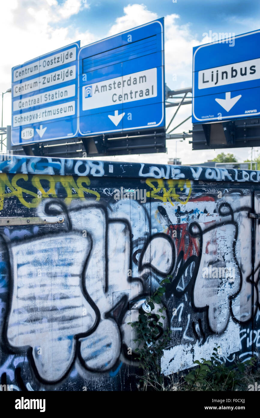 Gritty urban shot of Amsterdam road signs and grafitti Stock Photo