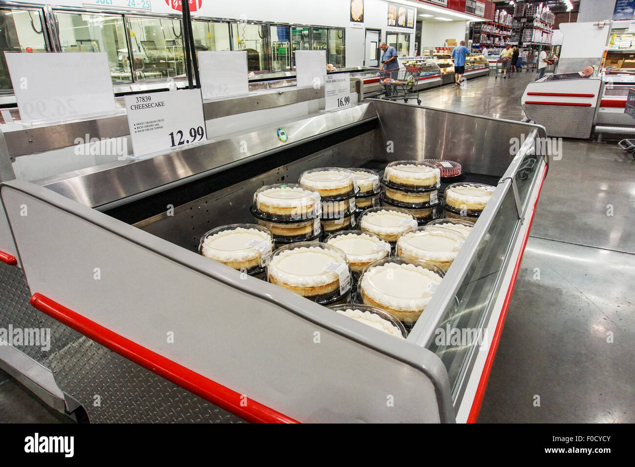 containers of rich luscious cheesecake with sour cream topping in a