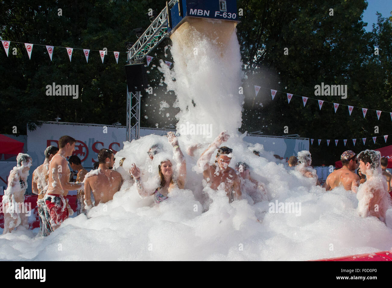 Budapest, Hungary. 12th Aug, 2015. Festival-goers enjoy a foam bath in the summer heat during the Sziget (Hungarian for 'Island') Festival on the Obuda Island in Budapest, Hungary, on August 12, 2015. The 23rd Sziget Festival held from Aug. 10 to 17 was one of the largest music festivals in Europe. Credit:  Attila Volgyi/Xinhua/Alamy Live News Stock Photo