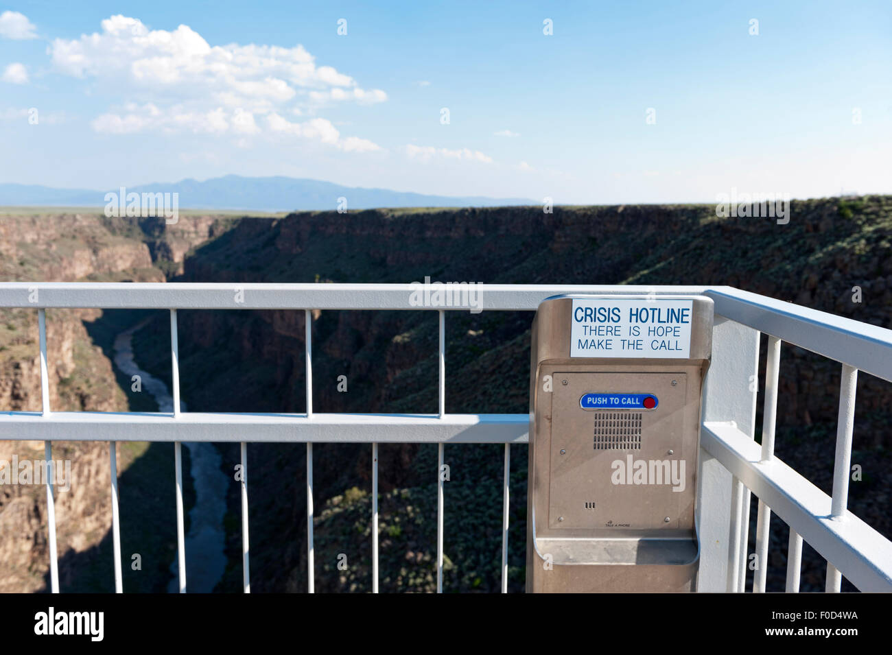 The bridge over the Rio Grande Gorge Bridge near Taos New Mexico is equipped with suicide crisis hot line phone. Stock Photo