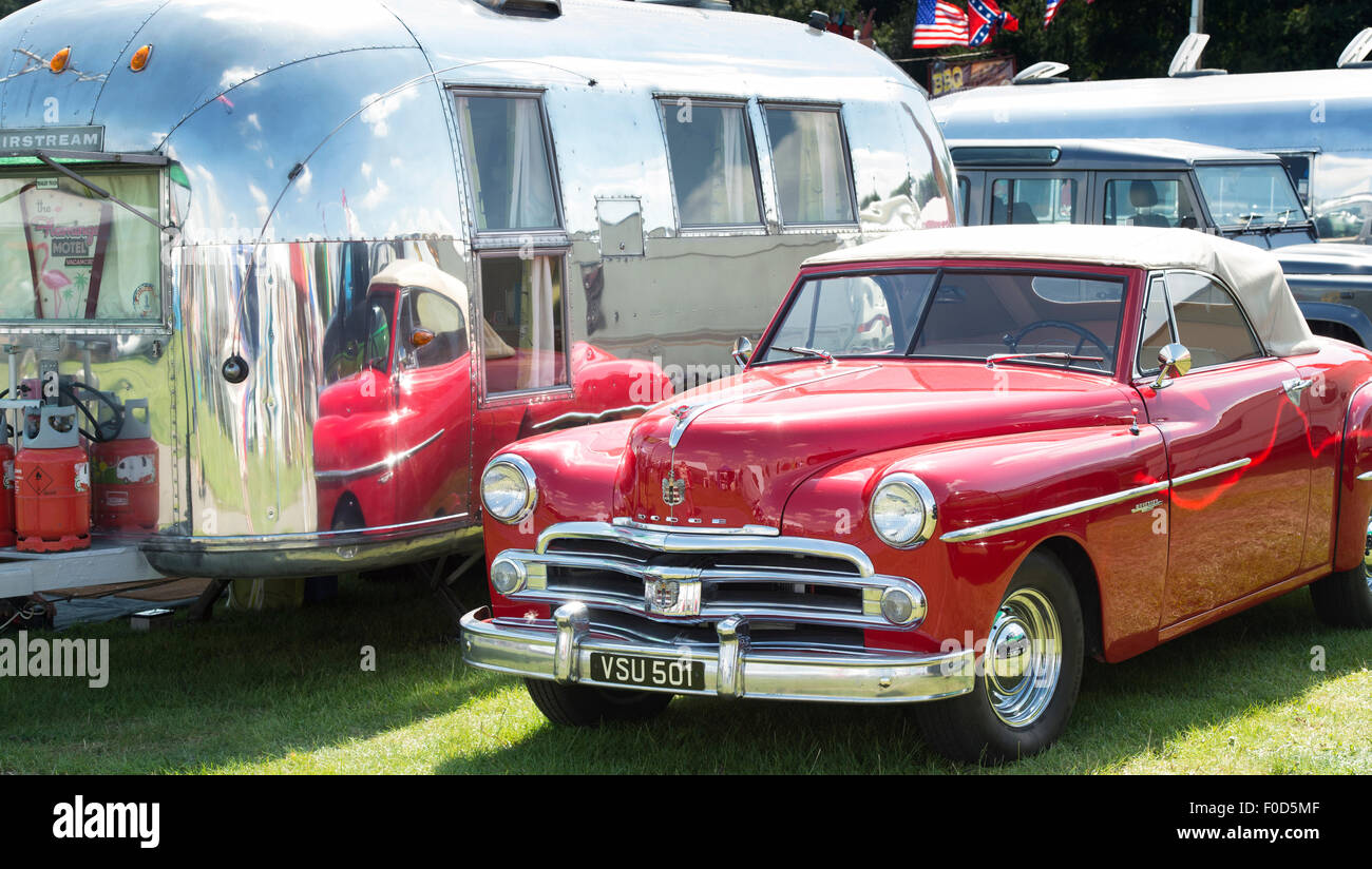 Dodge wayfarer american car reflected in an airstream caravan at a vintage retro festival. UK Stock Photo