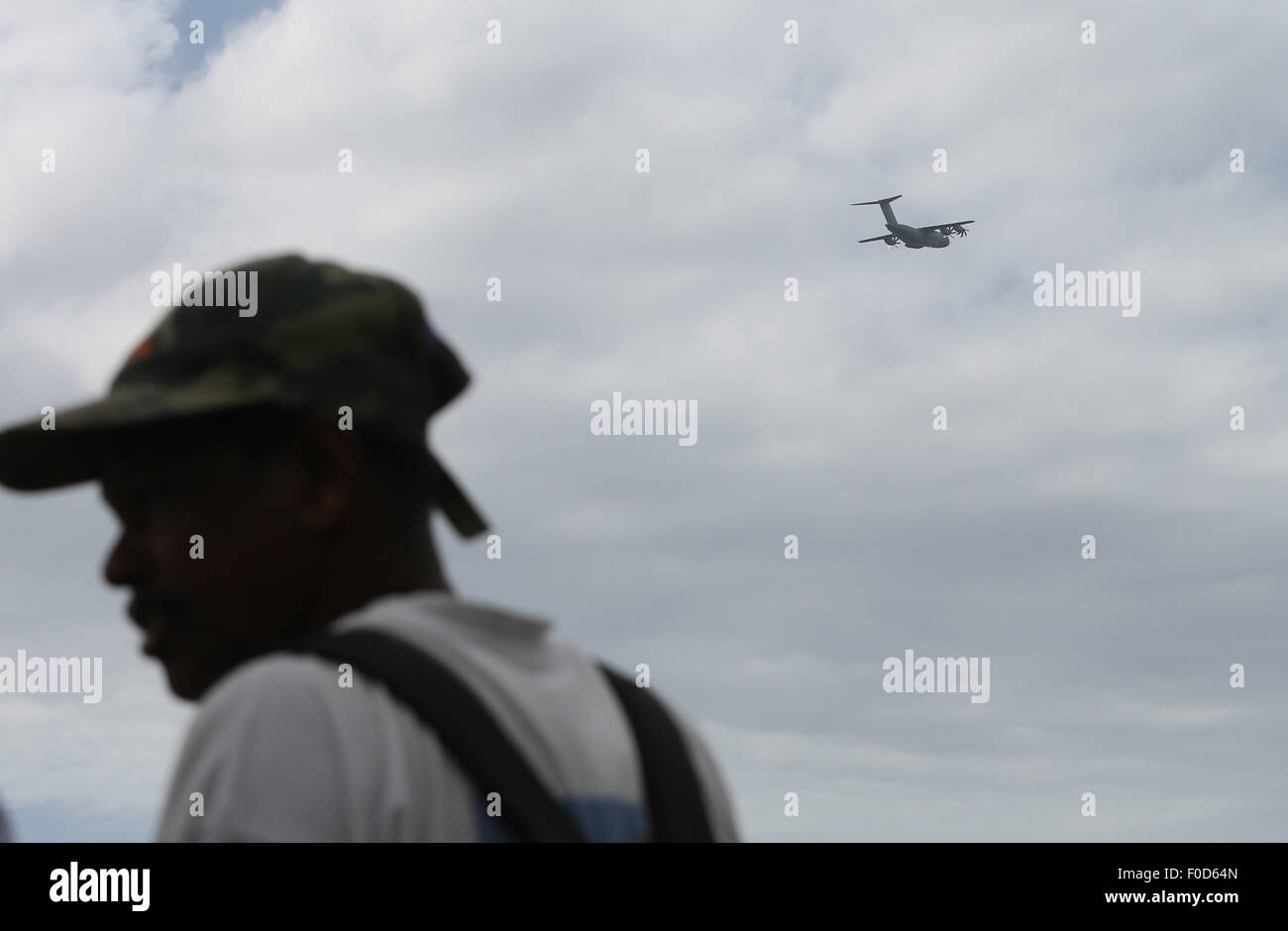 La Reunion, France's oversea island La Reunion. 12th Aug, 2015. An aircraft searching for MH370 debris flies over the Saint Andre beach, France's oversea island La Reunion, on Aug. 12, 2015. La Reunion authority Monday said that no clues related to the missing flight MH370 has been found here since the launch of a tridimensional search last Friday. Credit:  Pan Siwei/Xinhua/Alamy Live News Stock Photo