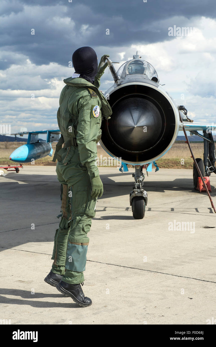 Romanian Air Force pilot during the pre-flight check of his MiG-21 LanceR C at Camp Turzii Air Base, Romania. Stock Photo