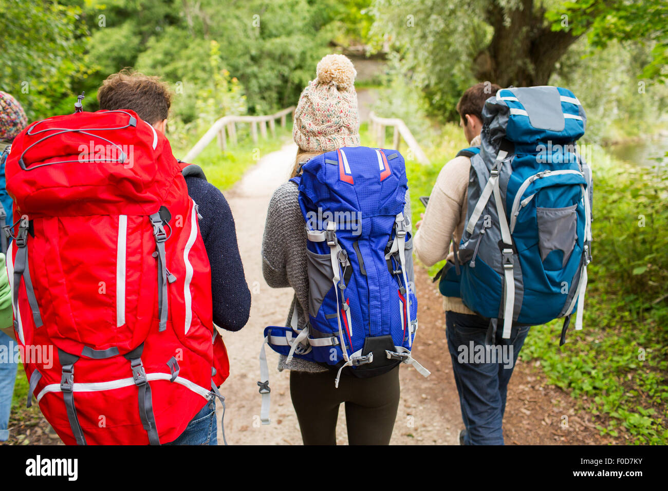 group of friends with backpacks hiking Stock Photo