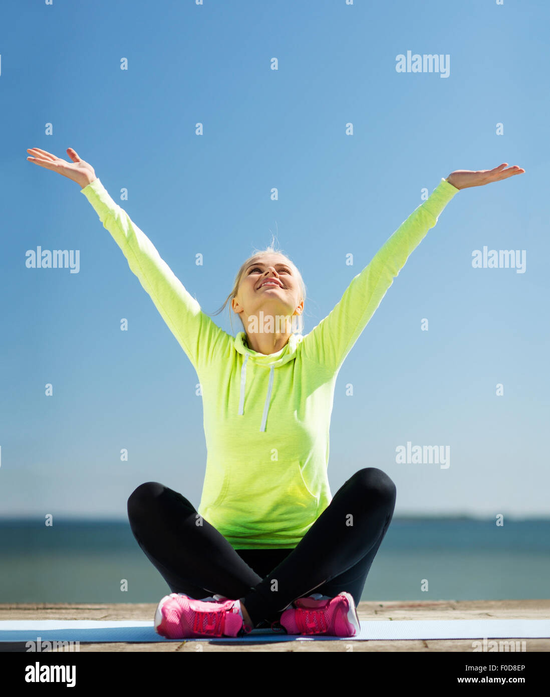 woman doing yoga outdoors Stock Photo