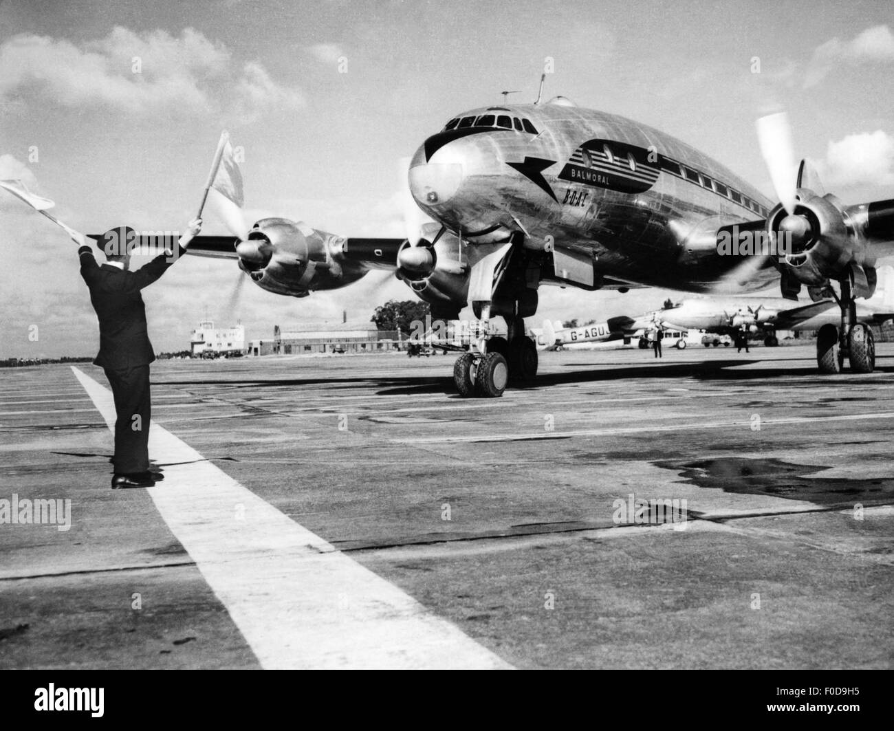 transport / transportation, aviation, passenger planes, Lockheed L-649 'Constellation', predecessor of the Super Constellation, BOAC airline, passenger plane on runway, air-traffic controller, London Airport, late 1940s, , Additional-Rights-Clearences-Not Available Stock Photo