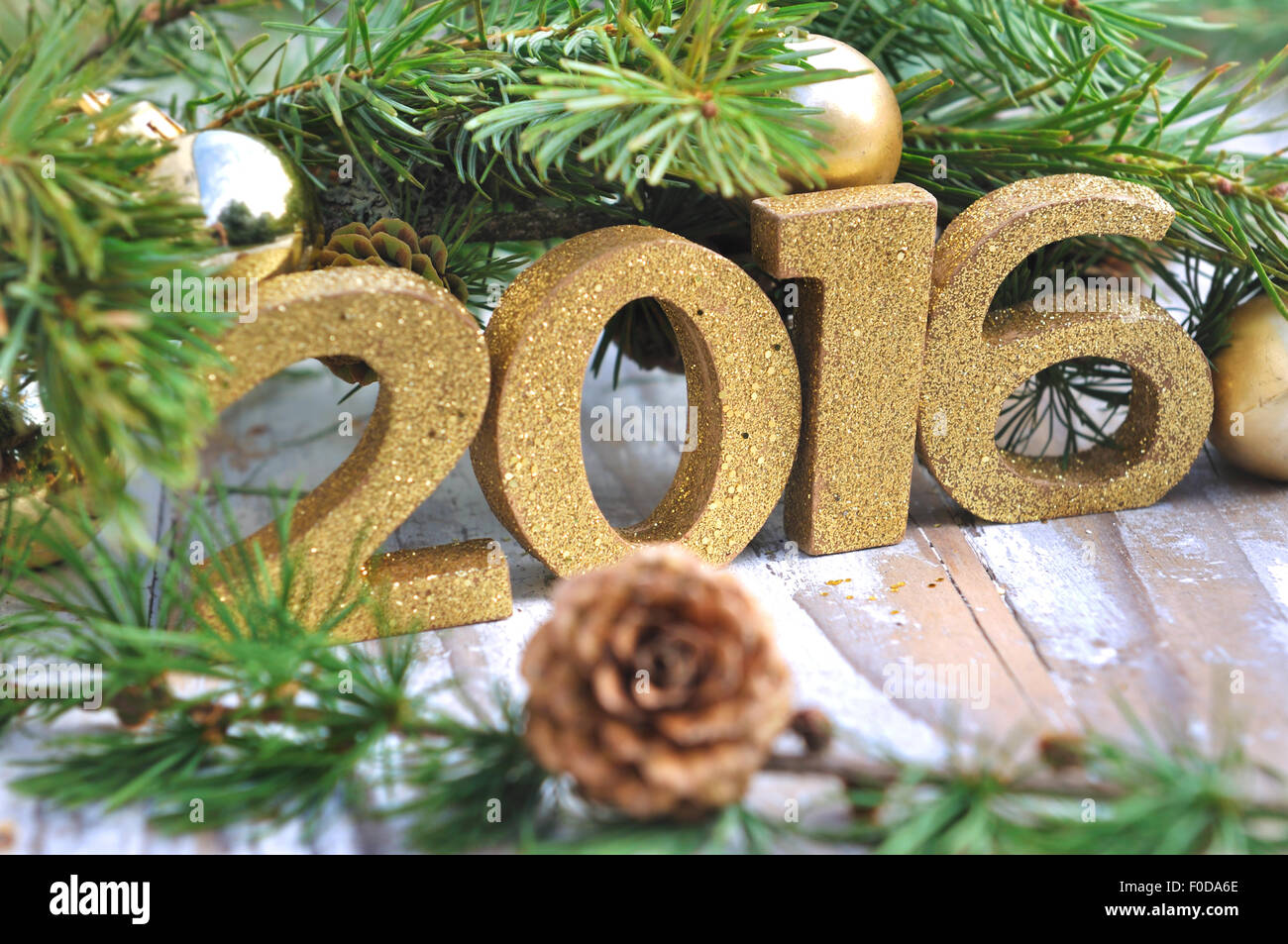 Christmas dinner table decoration with pine branches and golden cones.  Christmas centerpiece with golden decor. Christmas party Stock Photo - Alamy