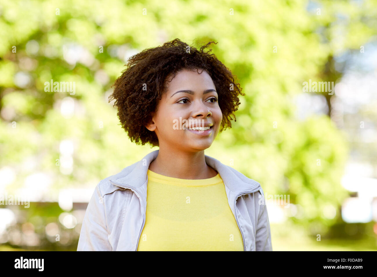 happy african american young woman in summer park Stock Photo - Alamy