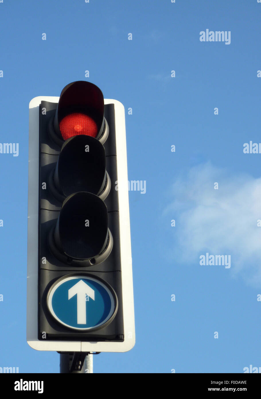 Closeup of red traffic light against blue sky Stock Photo - Alamy