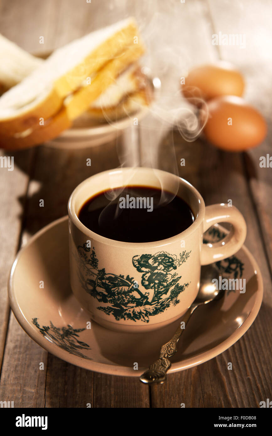 Traditional Singapore Chinese style coffee in vintage mug and saucer with  breakfast. Fractal on the cup is generic print. Soft f Stock Photo - Alamy
