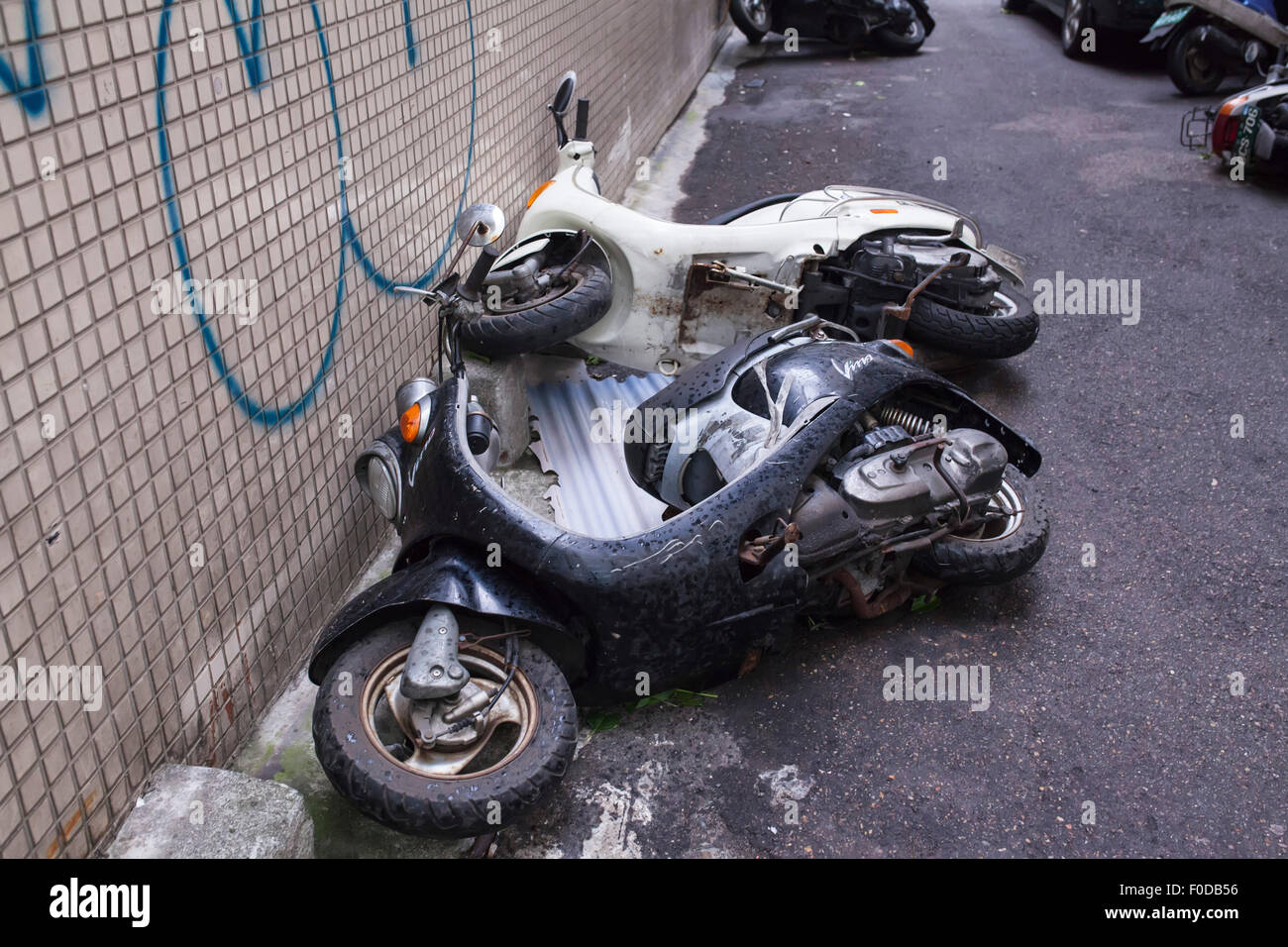Motor scooters blown over by enormous winds from Typhoon Soudelor in Taipei, Taiwan, August 8, 2015. Super typhoon Soudelor was the biggest storm of the year hitting Taiwan on Friday night and bringing heavy rains with strong winds reaching speed of 120 mph. Stock Photo