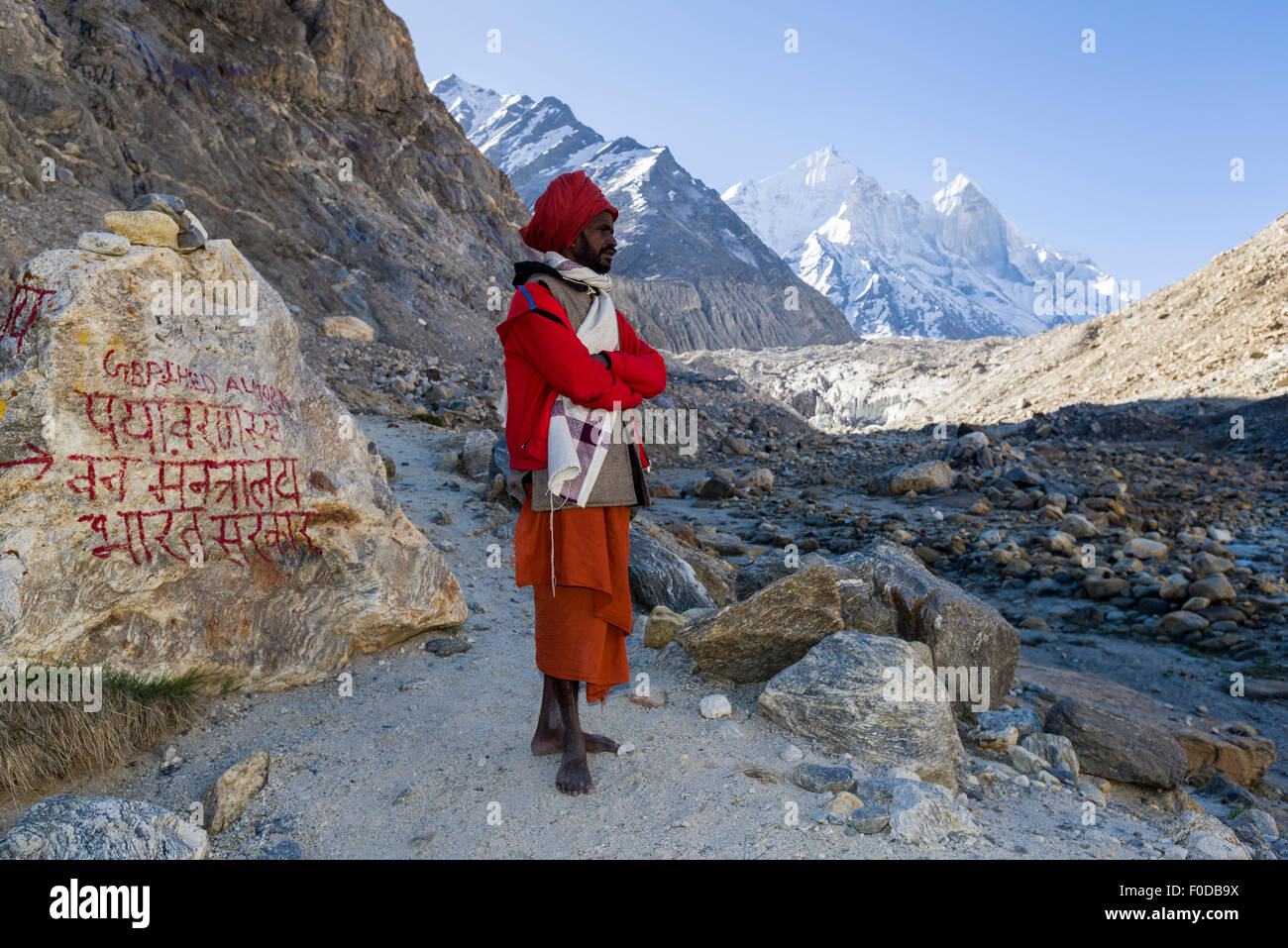 A Sadhu, holy man, on his way up to Gaumukh, the main source of the holy river Ganges, Gangotri, Uttarakhand, India Stock Photo