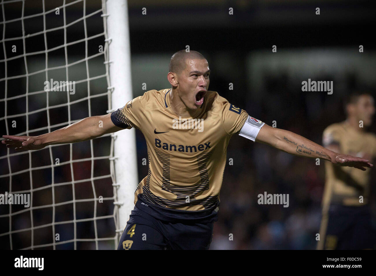 Mexico City, Mexico. 12th Aug, 2015. Image taken for Club Universidad Nacional A.C. (PUMAS) shows UNAM's Pumas Dario Veron celebrating his scoring during the match of Day 4 of 2015 Opening Tournament of MX League against Atlas, at University Olympic Stadium, in Mexico City, capital of Mexico, on Aug. 12, 2015. Credit:  Alejandro Ayala/Xinhua/Alamy Live News Stock Photo