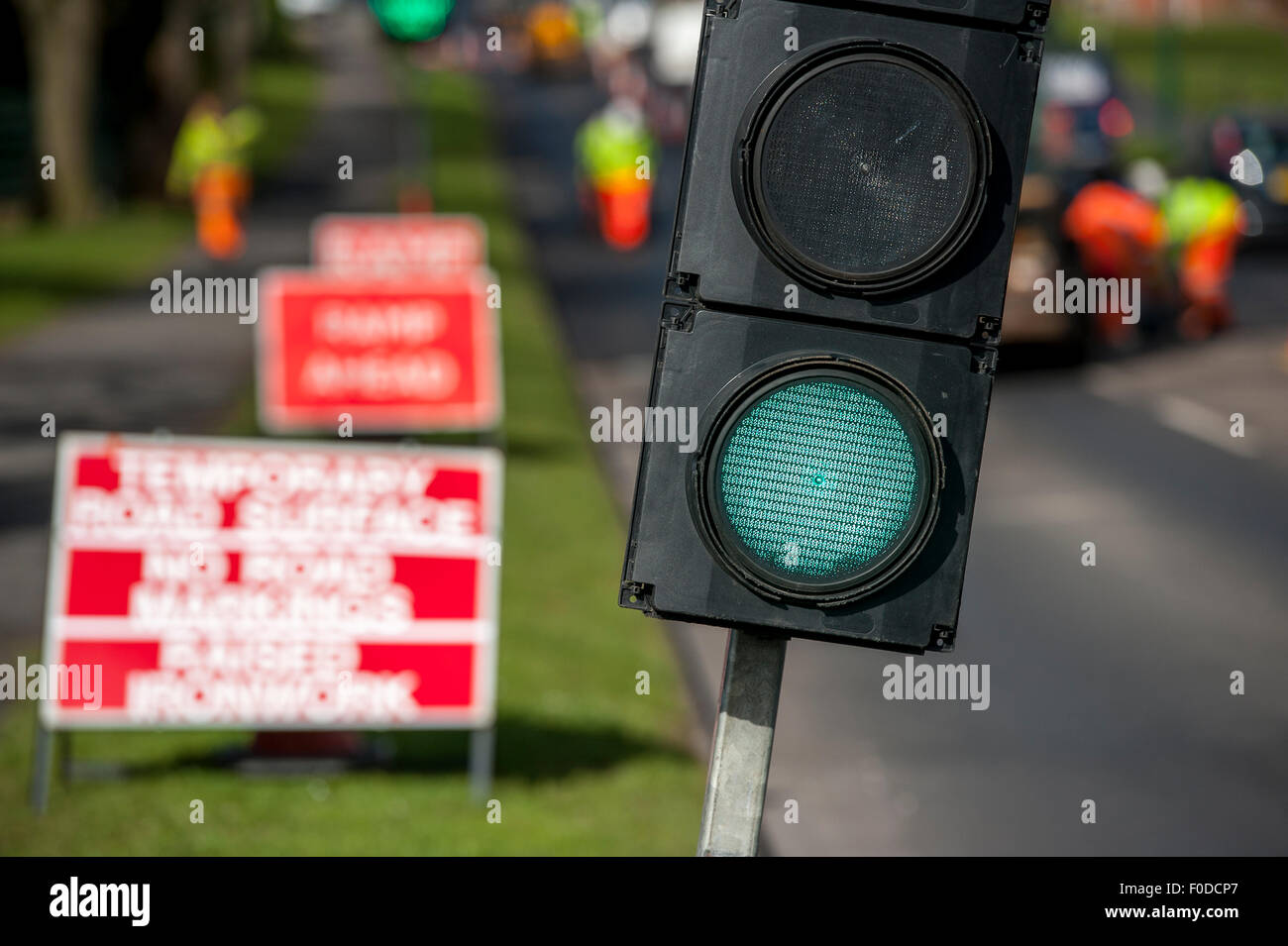 Temporary traffic lights at roadworks in England. Stock Photo