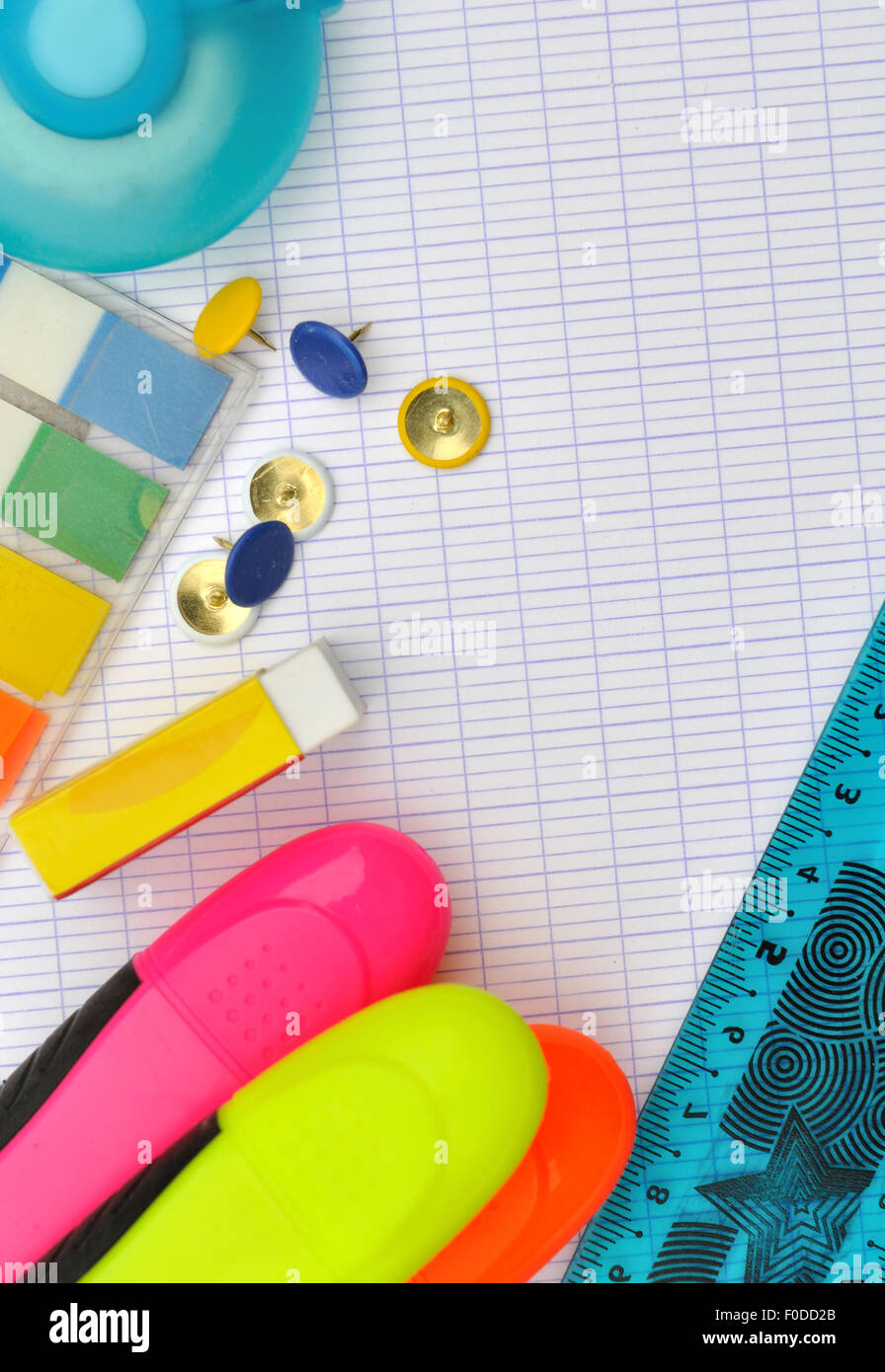highlighters, eraser,push pins and other supplies on white paper Stock Photo