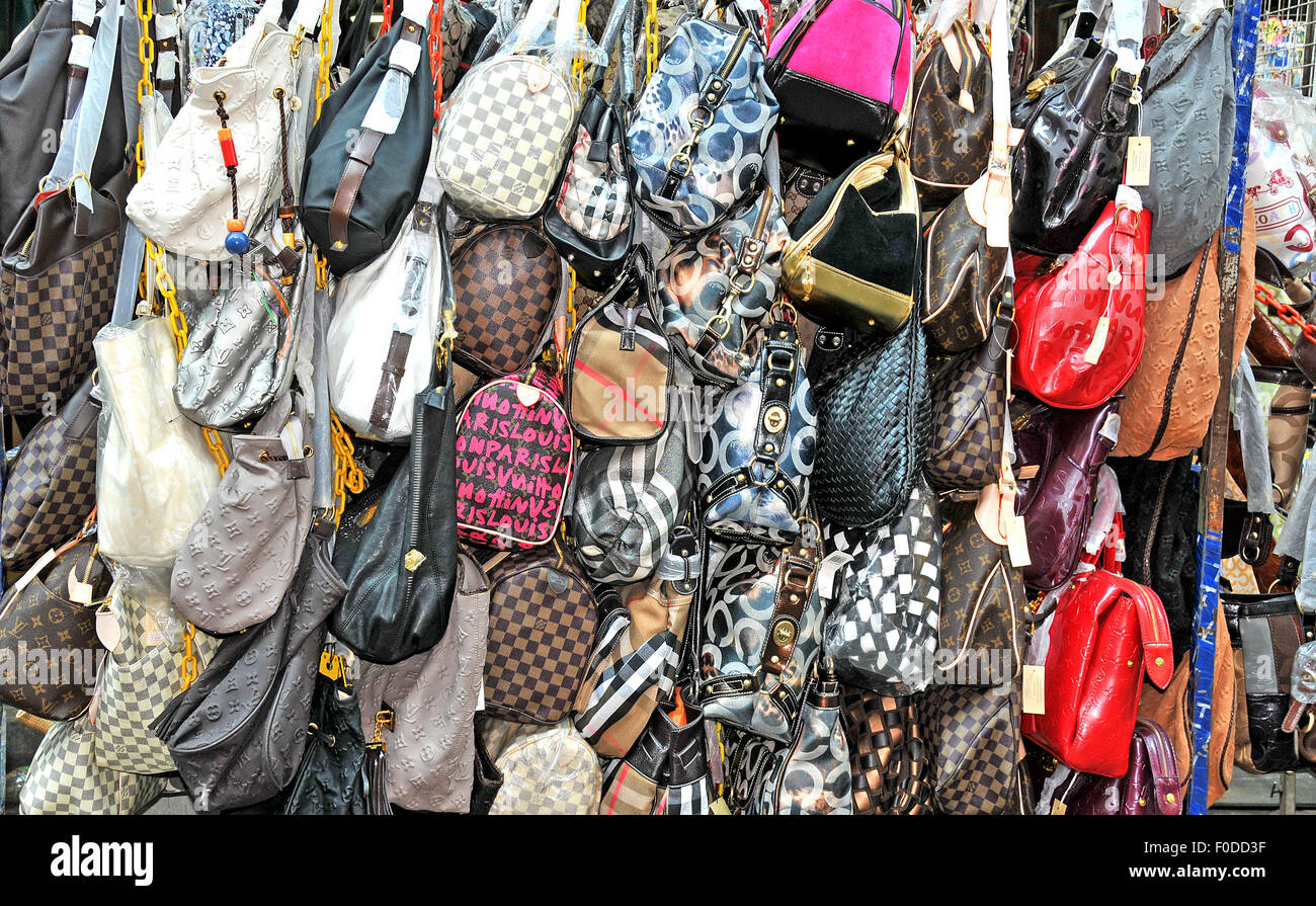 FILE--Fake Louis Vuitton handbags are confiscated at a warehouse in  Guangzhou city, south Chinas Guangdong province, 15 July 2012. Thousands of  fa Stock Photo - Alamy