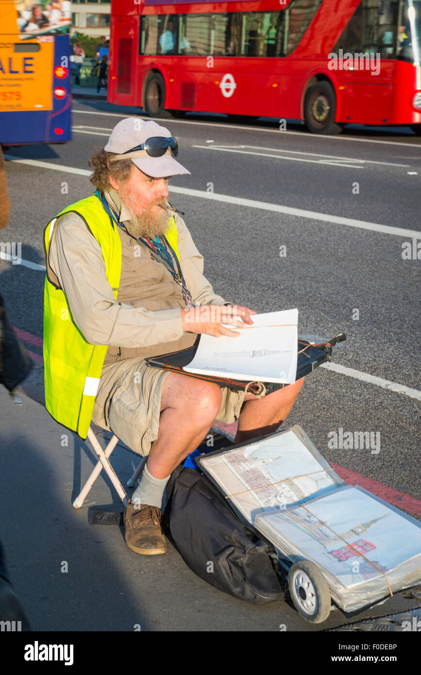 Southbank Westminster Bridge street seated bearded artist draws London sights for tourists red bus Stock Photo