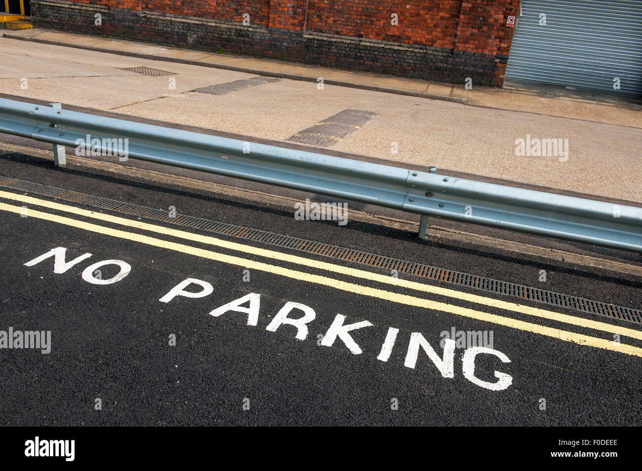 Double yellow lines in a no parking zone in England Stock Photo Alamy