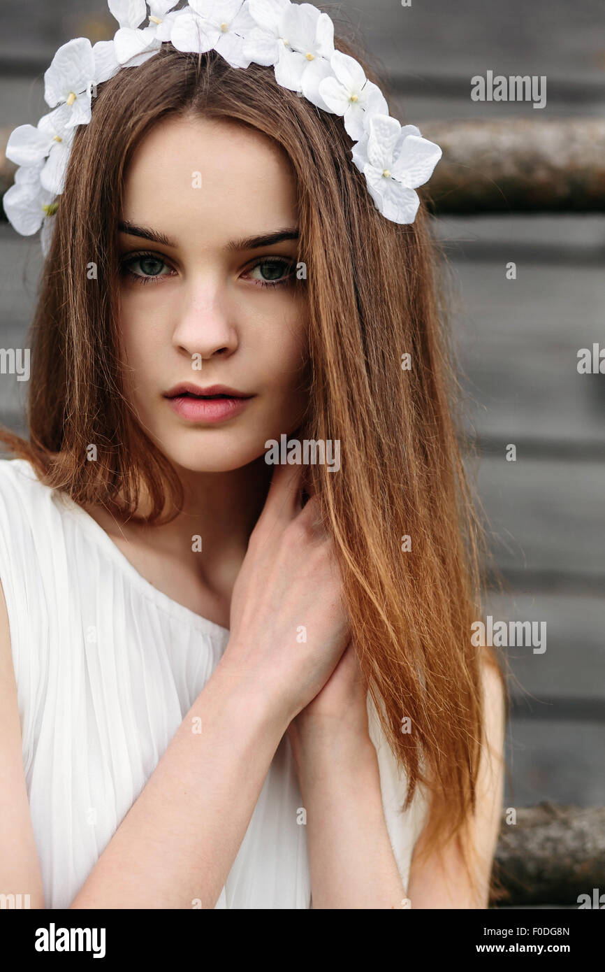 Girl climbing ladder into tree house