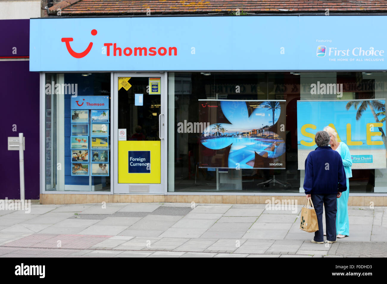 A Thomson, First Choice, TUI travel agency shop on a High St in a typical British Town. The shops give the company a shop front presence as well as providing a booking service for those not willing to use the internet. Stock Photo