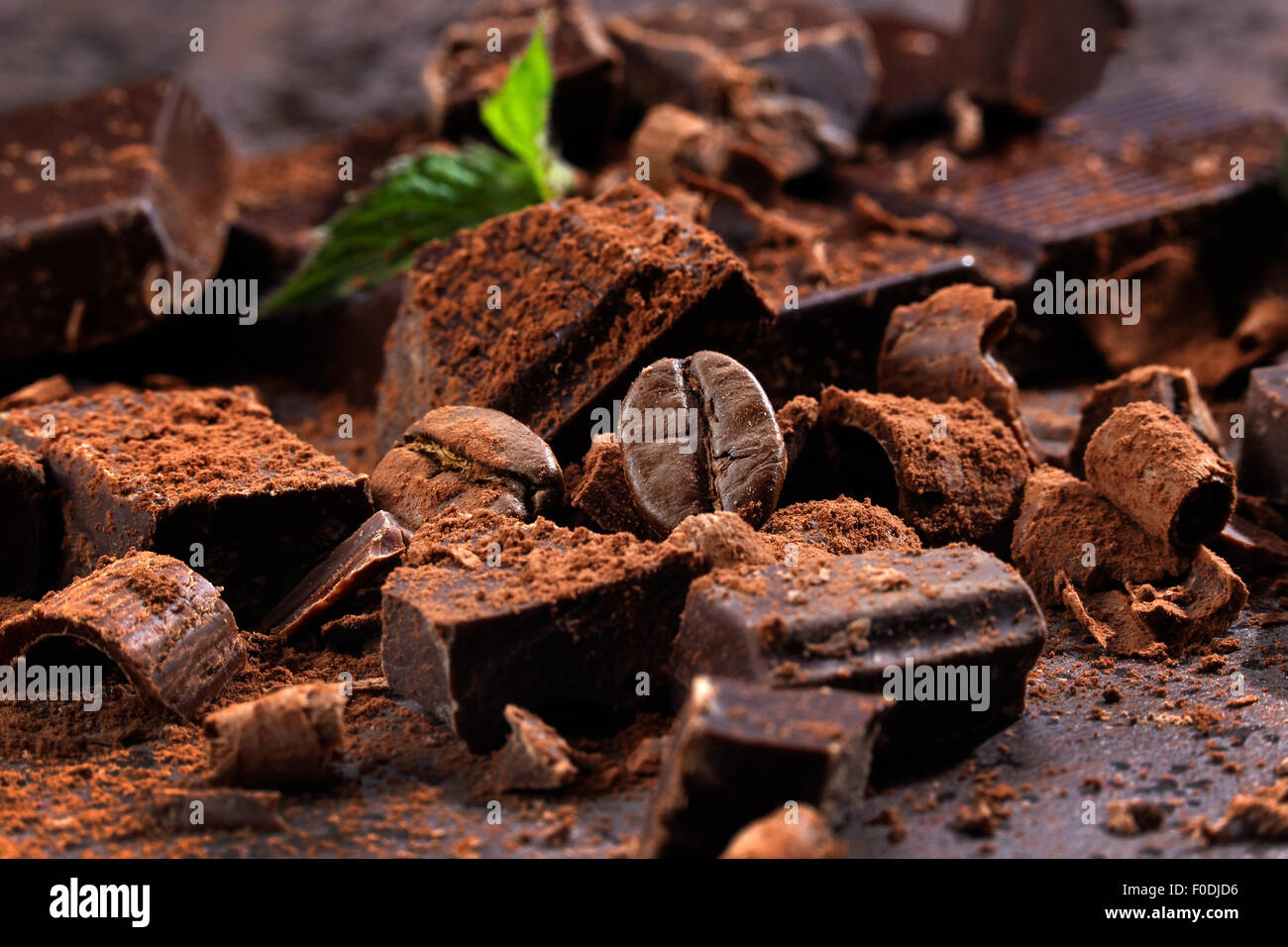 Broken dark chocolate on a wooden table Stock Photo