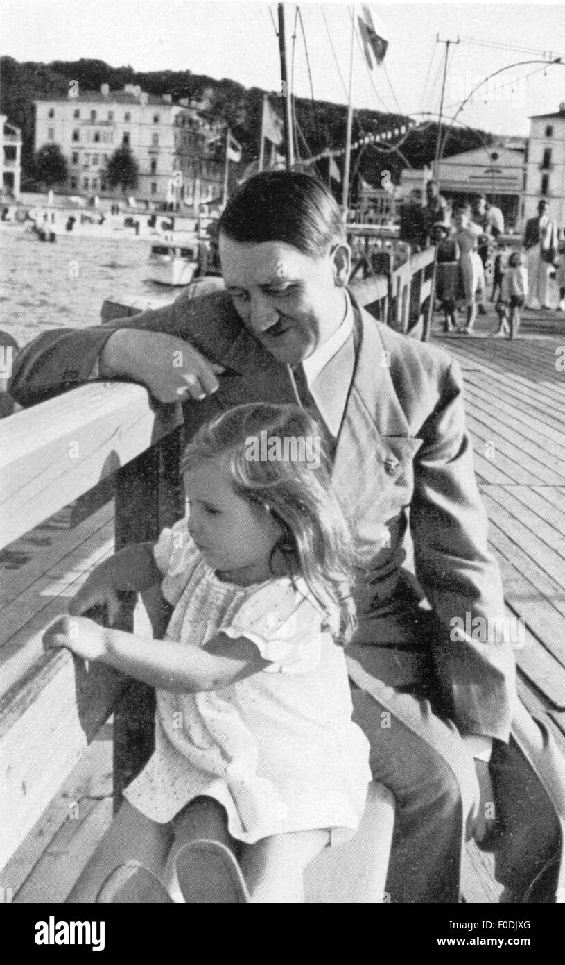 Hitler, Adolf, 20.4.1889 - 30.4.1945, German politician (NSDAP), Chancellor of the Reich 30.1.1933 - 30.4.1945, with Helga Goebbels, 1935, Stock Photo
