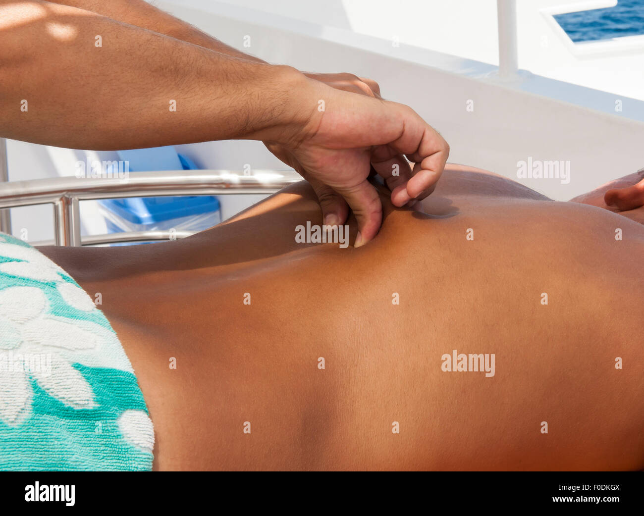 Lower back massage hi-res stock photography and images - Alamy