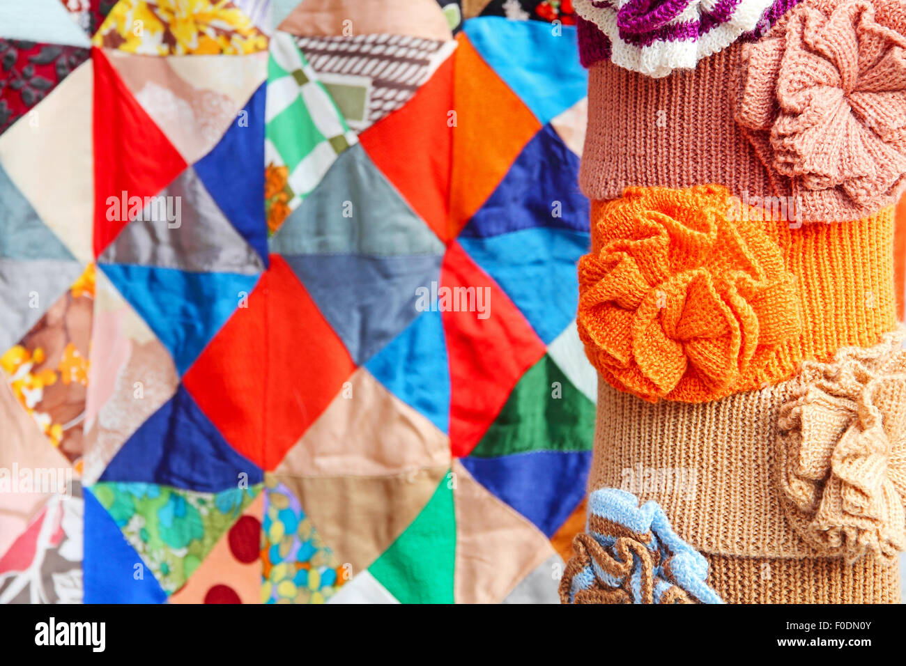 Multicolored clothing accessory on colorful patchwork quilt abstract background. Stock Photo